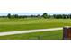 Picturesque backyard view featuring a lush green golf course, offering serene outdoor scenery and recreational opportunities at 6776 Salvia Ct, Arvada, CO 80007