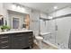 Modern bathroom with a sleek vanity, glass-enclosed shower, and stylish fixtures for a luxurious experience at 6776 Salvia Ct, Arvada, CO 80007