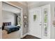 Inviting entryway leading to bedroom with stylish decor and ample natural light at 6776 Salvia Ct, Arvada, CO 80007