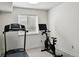 Functional exercise room with treadmill and stationary bike, perfect for maintaining a healthy lifestyle at 6776 Salvia Ct, Arvada, CO 80007