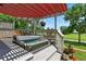Tranquil backyard deck with a hot tub, offering a private retreat for relaxation and overlooking a lush green landscape at 6776 Salvia Ct, Arvada, CO 80007