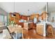 Open kitchen layout with stainless steel appliances and a center island at 6776 Salvia Ct, Arvada, CO 80007