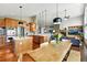 Beautiful kitchen with an open floor plan featuring modern appliances and hardwood floors at 6776 Salvia Ct, Arvada, CO 80007