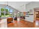Open-concept living space with vaulted ceilings and seamless access to the kitchen at 6776 Salvia Ct, Arvada, CO 80007