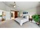 Comfortable main bedroom with vaulted ceilings, carpet flooring, and plenty of natural light at 6776 Salvia Ct, Arvada, CO 80007