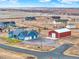 Aerial view of house and property, including a large detached garage at 767 S Main St, Byers, CO 80103