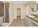 Bathroom with shower, vanity, and walk-in closet at 767 S Main St, Byers, CO 80103