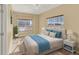 Well-lit bedroom with window seat and ample closet space at 767 S Main St, Byers, CO 80103