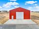 Detached garage with large roll-up door at 767 S Main St, Byers, CO 80103