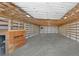 Interior of a large garage with a loft at 767 S Main St, Byers, CO 80103