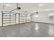 Spacious three-car garage with epoxy floor and ample storage at 767 S Main St, Byers, CO 80103