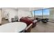 Common area furnished with tables, a plush couch, and floor-to-ceiling windows for natural light and views at 1155 N Ash St # 1206, Denver, CO 80220