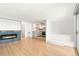 Open-concept living room featuring a fireplace and an updated kitchen, perfect for entertaining at 1155 N Ash St # 1206, Denver, CO 80220