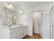 Bright bathroom with double vanity, quartz countertops, and a glass-enclosed shower at 459 S Salida St, Aurora, CO 80017
