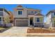 Charming two-story home featuring stone accents and a covered front porch at 459 S Salida St, Aurora, CO 80017