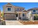 Charming two-story home featuring stone accents and a covered front porch at 459 S Salida St, Aurora, CO 80017