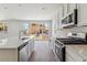Modern kitchen featuring stainless steel appliances, and a gas range at 459 S Salida St, Aurora, CO 80017