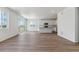 Open-concept living area with wood floors flowing into a modern kitchen at 459 S Salida St, Aurora, CO 80017
