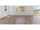 Open-concept living area with wood floors and ample natural light at 459 S Salida St, Aurora, CO 80017