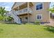 Well-maintained backyard features a large grassy area, stairs, and a deck at 836 Sundance Ln, Erie, CO 80516