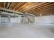 Spacious basement features open ceiling, sealed walls, and concrete flooring, ready to be customized at 836 Sundance Ln, Erie, CO 80516
