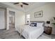 This bedroom features a ceiling fan, natural light, and ensuite bathroom at 836 Sundance Ln, Erie, CO 80516