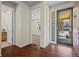 Foyer featuring hardwood floors and natural light from the front door at 836 Sundance Ln, Erie, CO 80516
