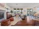 Comfortable living room with hardwood floors, ample natural light, and an open layout at 836 Sundance Ln, Erie, CO 80516