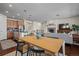 Open-concept layout showcasing the kitchen, dining, and living area with a fireplace at 836 Sundance Ln, Erie, CO 80516