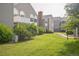 Lush green backyard featuring various townhouses in the background at 3331 S Monaco Pkwy # D, Denver, CO 80222