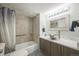 Updated bathroom featuring modern vanity, sink, and stylish shower with tile surround at 3331 S Monaco Pkwy # D, Denver, CO 80222