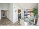 Dining room with glass table and chairs and adjoins with the kitchen at 3331 S Monaco Pkwy # D, Denver, CO 80222