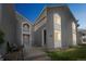 Inviting condo exterior featuring a private balcony, pathway, and well-manicured lawn, perfect for a relaxing evening at 3331 S Monaco Pkwy # D, Denver, CO 80222