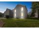Spacious condo exterior with a well-maintained lawn, offering a picturesque view and ample space for outdoor activities at 3331 S Monaco Pkwy # D, Denver, CO 80222