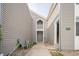Charming condo entrance with a private balcony, complemented by inviting outdoor seating and well-maintained landscaping at 3331 S Monaco Pkwy # D, Denver, CO 80222