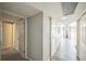 Bright hallway with modern finishes and natural light leading to multiple rooms at 3331 S Monaco Pkwy # D, Denver, CO 80222