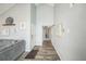 Bright hallway with luxury vinyl flooring leading to various rooms in the home at 3331 S Monaco Pkwy # D, Denver, CO 80222