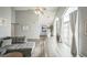 Open-concept living room flows into a dining area with expansive windows, offering ample natural light and a seamless design at 3331 S Monaco Pkwy # D, Denver, CO 80222
