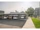 Parking area featuring a covered parking structure and well-maintained landscaping at 3331 S Monaco Pkwy # D, Denver, CO 80222