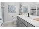 Clean and modern bathroom with gray vanity and walk-in shower at 7033 S Waterloo Way, Aurora, CO 80016