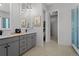 Modern bathroom with double vanity and walk-in shower at 7033 S Waterloo Way, Aurora, CO 80016