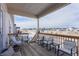 Deck with seating area overlooking a neighborhood view at 7033 S Waterloo Way, Aurora, CO 80016