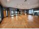 Yoga and fitness studio with wood floors and mirrors at 7033 S Waterloo Way, Aurora, CO 80016