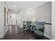 Hallway with two green chairs and hardwood floors at 7033 S Waterloo Way, Aurora, CO 80016