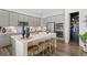 Modern kitchen with gray cabinets, an island, and walk-in pantry at 7033 S Waterloo Way, Aurora, CO 80016