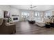 Spacious living room with a fireplace and large sectional sofa at 7033 S Waterloo Way, Aurora, CO 80016