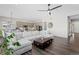 Open living space with a large sectional sofa and kitchen views at 7033 S Waterloo Way, Aurora, CO 80016
