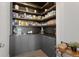 Well-organized pantry with ample shelving and counter space at 7033 S Waterloo Way, Aurora, CO 80016