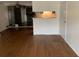 Hardwood floor living room with open concept to kitchen at 14141 E Jewell Ave # 102, Aurora, CO 80012