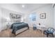 This bedroom features neutral colors, a small desk, and natural lighting at 3928 N Riviera Ct, Aurora, CO 80019